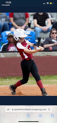 a softball player swinging a bat on an iphone